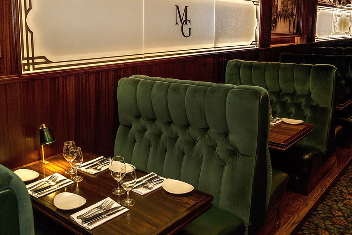 The dark green cushioned booths at Metropolitan Grill in downtown Seattle 