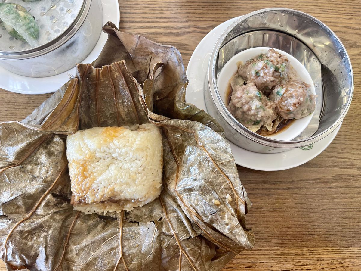 Sticky lotus rice with opened lotus leaf and a side of hot beef balls with bean curd skin.