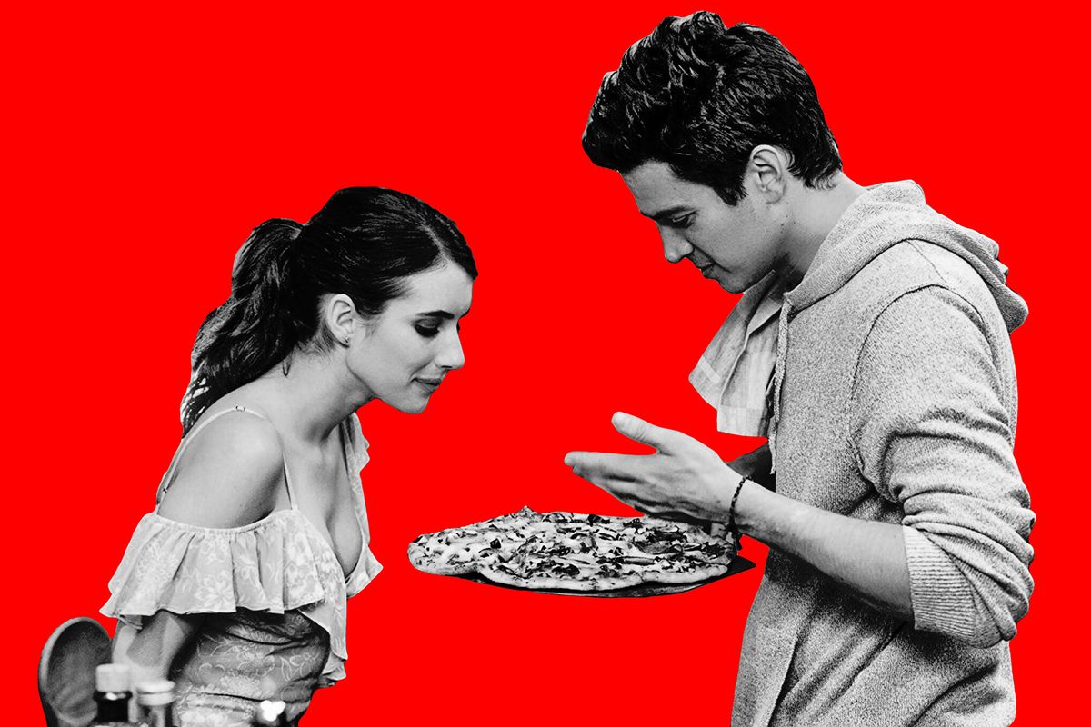 Emma Roberts and Hayden Christensen looking at a pizza