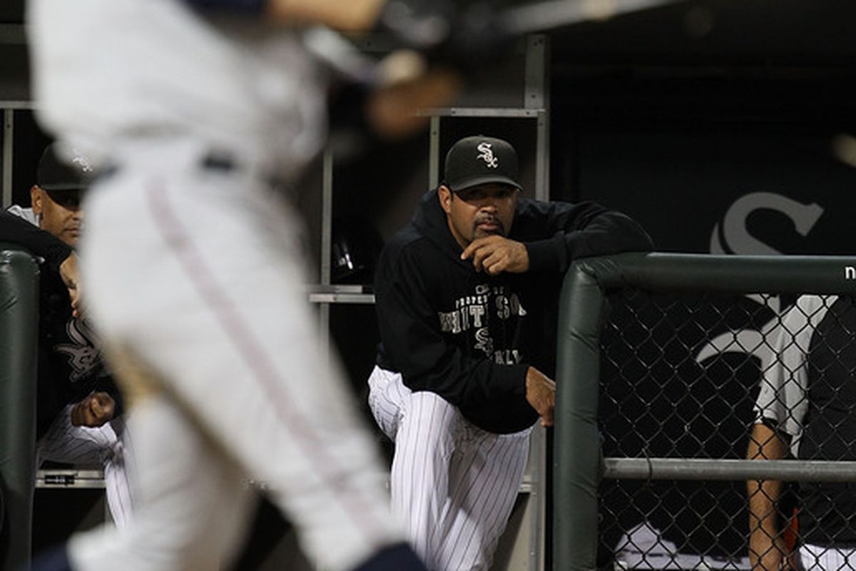 CHICAGO - SEPTEMBER 14: Manager Ozzie Guillen #13 of the Chicago White Sox watches as Jim Thome #25 of the Minnesota Twins takes a swing at U.S. Cellular Field on September 14 2010 in Chicago Illinois. (Photo by Jonathan Daniel/Getty Images)