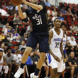 Utah Jazz's Georges Niang passes the ball during the second half of the team's NBA summer league basketball game against the Orlando Magic on Thursday, July 12, 2018, in Las Vegas. (AP Photo/John Locher)