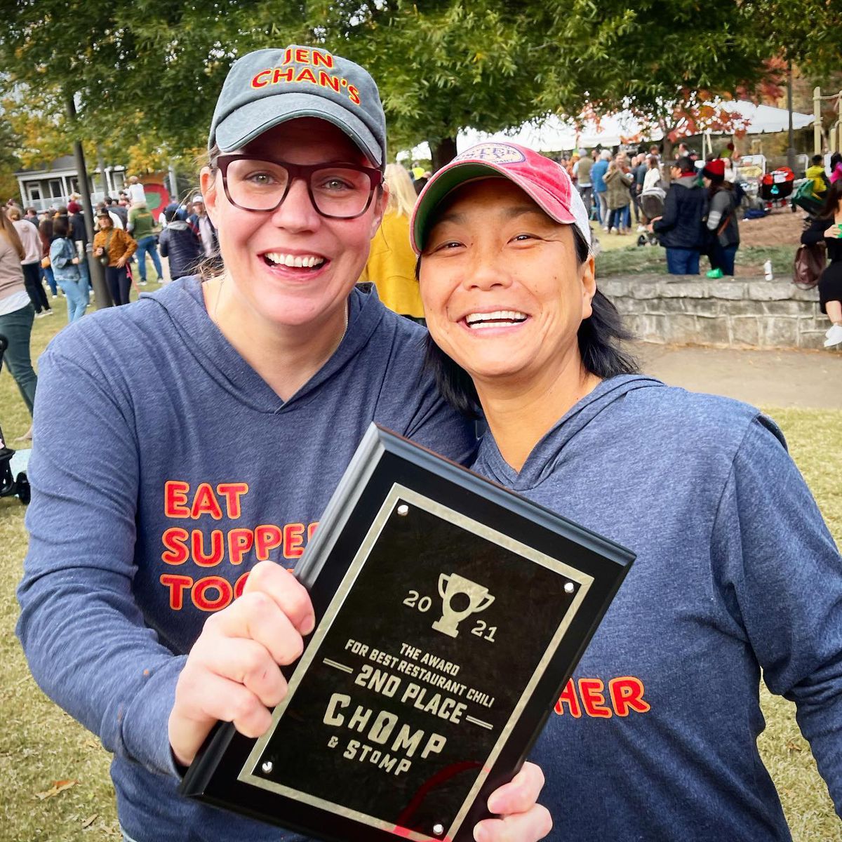 Emily and Jen Chan, owners of JenChan’s restaurant in Cabbagetown, joyously posing with their 2nd place award for best chili at Chomp and Stomp Chili Cookoff Contest in 2021. 