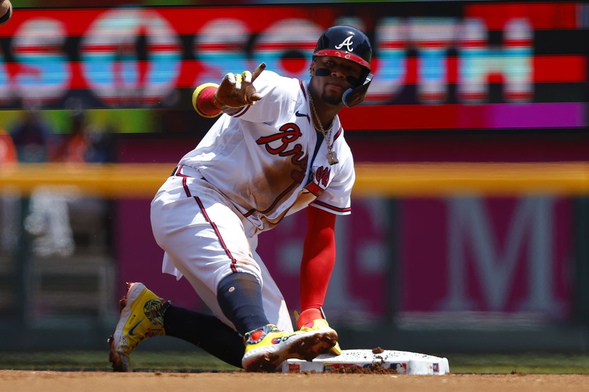 Ronald Acuna Jr. of the Atlanta Braves reacts after stealing second base during the first inning against the Houston Astros at Truist Park on April 23, 2023 in Atlanta, Georgia.