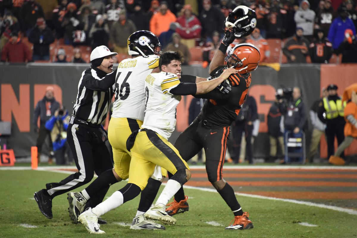 Quarterback Mason Rudolph of the Pittsburgh Steelers fights with defensive end Myles Garrett of the Cleveland Browns during the second half at FirstEnergy Stadium on November 14, 2019 in Cleveland, Ohio.