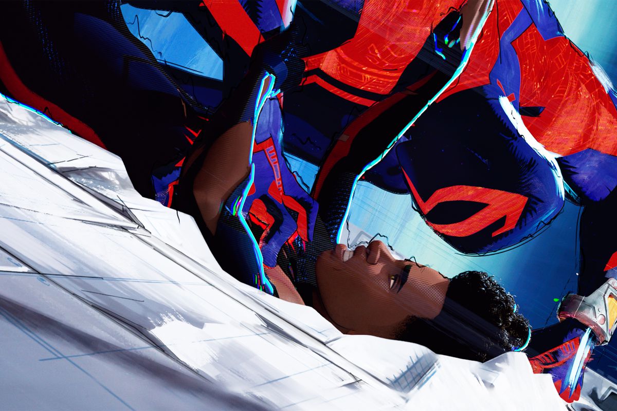 Spider-Man 2099, a version of Spider-Man with a luchador-like mask and long blades on his arms, presses Miles Morales into the side of a building so hard that it leaves a divot in Spider-Man: Across the Spider-Verse