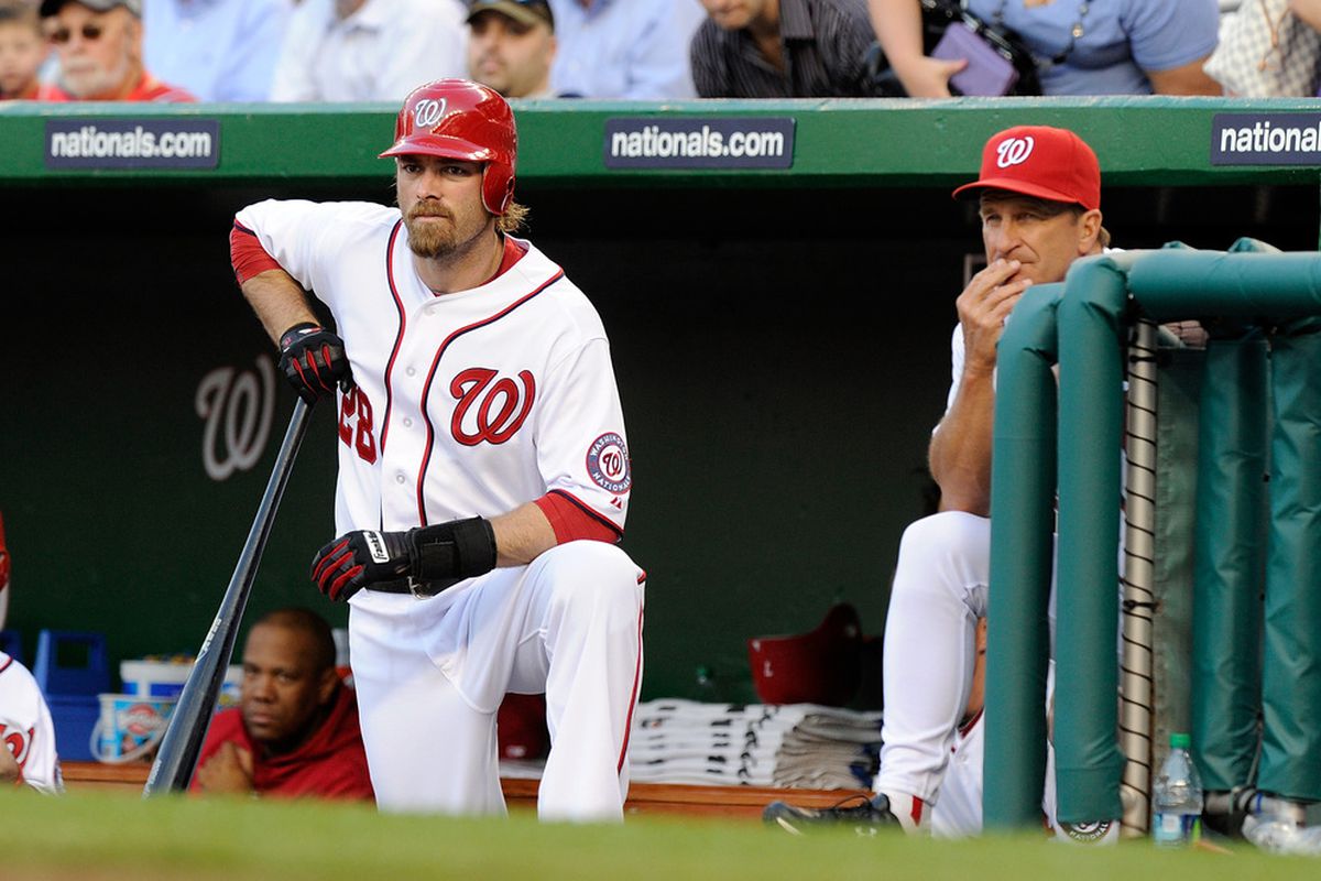 WASHINGTON, DC - APRIL 28:  Jayson Werth #28 and manager Jim Riggleman #5 of the Washington Nationals watch the game against the New York Mets at Nationals Park on April 28, 2011 in Washington, DC.  (Photo by Greg Fiume/Getty Images)