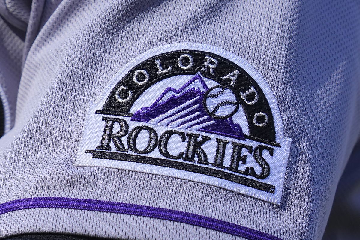 A close up view of the Colorado Rockies logo on the sleeve of an unknown players uniform