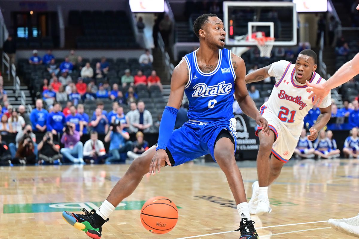 Drake guard D.J. Wilkins looks to drive to the basket as Bradley guard Duke Deen defends during a game between the Drake Bulldogs and the Bradley Braves in the finals of the Missouri Valley Conference Basketball Tournament on March 05, 2023, at Enterprise Center in St. Louis, MO  &nbsp;