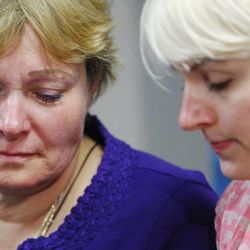 Tara Evans and her daughter Karen listen to a press conference at Ogden's McKay-Dee Hospital Center as they talk about the condition of their husband and father, James Evans, Monday, June 17, 2013. Police say James Evans was shot in the head by Charles Richard Jennings Jr. while attending Mass at St. James Catholic Church in Ogden.