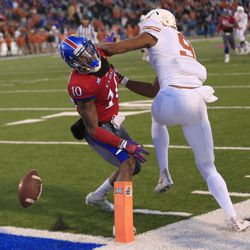 Kansas cornerback Marnez Ogletree (10) is called for pass interference on Texas wide receiver Collin Johnson (9) during the second half of an NCAA college football game in Lawrence, Kan., Saturday, Nov. 19, 2016. 