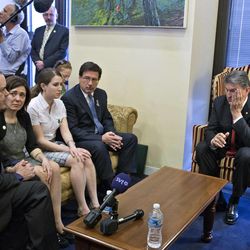 Sen. Joe Manchin, D-W.Va., seated right, meets in his office with families of victims of the  Sandy Hook Elementary School shooting in Newtown, Conn., on the day he announced that they have reached reached a bipartisan deal on expanding background checks to more gun buyers, on Capitol Hill in Washington, Wednesday, April 10, 2013.