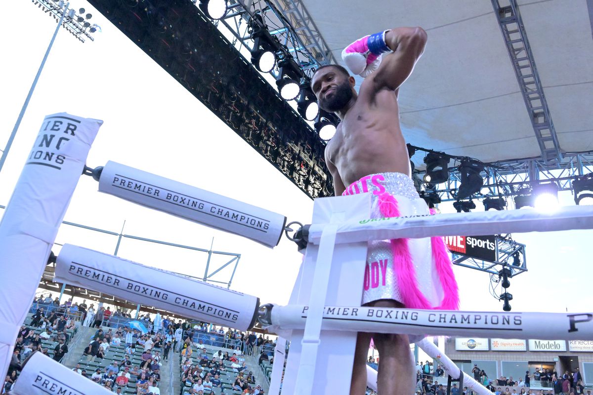 Jaron Ennis (pink shorts) celebrates in the ring after defeating Custio Clayton in their welterweight title fight at Dignity Health Sports Park on May 14, 2022 in Carson, California.