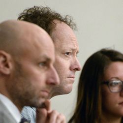 John Brickman Wall, center, listens to the prosecution's opening statement to the jury in his murder trial in 3rd District Court Wednesday, Feb. 18, 2015 in Salt Lake City. Wall is accused of killing his former wife, Uta von Schwedler, in 2011.

