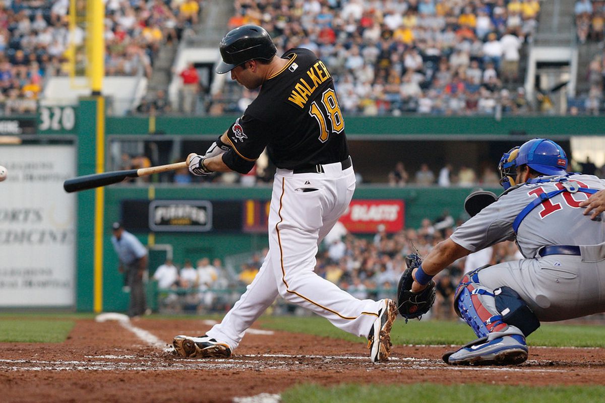 PITTSBURGH - JULY 08: Neil Walker #18 of the Pittsburgh Pirates hits a two run single against the Chicago Cubs in the third inning during the game on July 8, 2011 at PNC Park in Pittsburgh, Pennsylvania.  (Photo by Jared Wickerham/Getty Images)