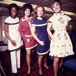 Modeling the uniform variations of the early 70s. Photo via <a href-"http://www.amusingplanet.com/2011/04/style-in-aisle-flight-attendant-fashion.html">Amusing Planet.</a>