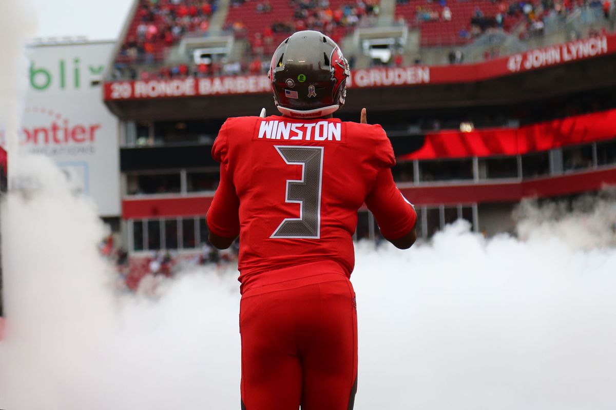 Tampa Bay Buccaneers quarterback Jameis Winston runs out of the tunnel as he is introduced before a game against the New Orleans Saints at Raymond James Stadium.