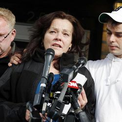 Patty Campbell, center, flanked by her brother, John Reilly, and son, Billy, makes a statement to reporters outside her home in Medford, Mass., Tuesday, April 16, 2013. Campbell's daughter, Krystle Campbell, was killed in Monday's bombings at the finish line of the Boston Marathon. 