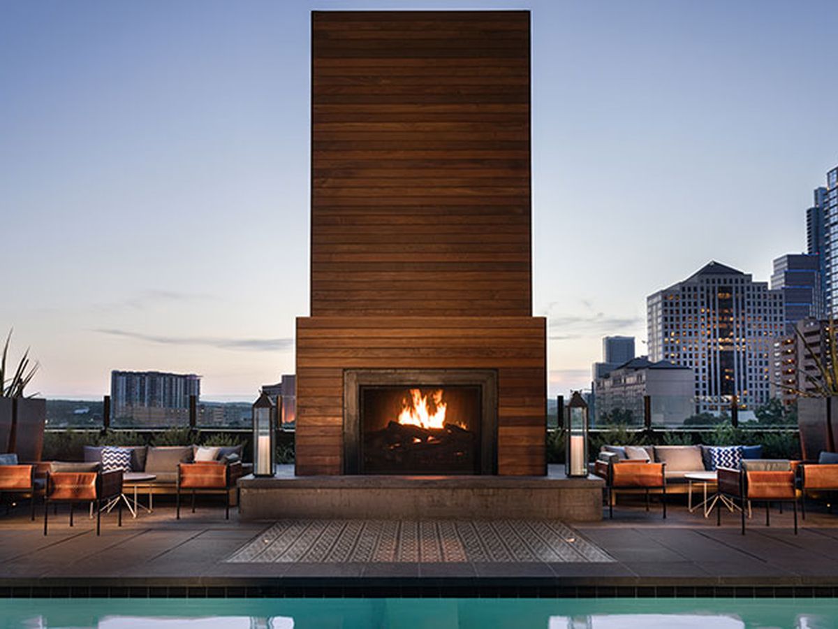 A pool with a fireplace.