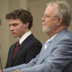 Alexander Jordan Robinson, left, listens to his attorney, Loni DeLand, during his sentencing for his role in a clandestine drug operation that he — along with his brother Zachary Ryan Robinson and his father, James Wesley Robinson — ran from the family’s Sugar House home. All three of the men were sentenced in Judge James Blanch's court at the Matheson Courthouse in Salt Lake City, Friday, Feb. 13, 2015. 