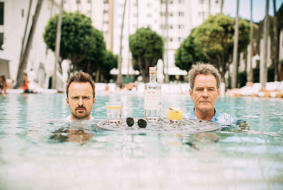 two men in the water with mezcal.