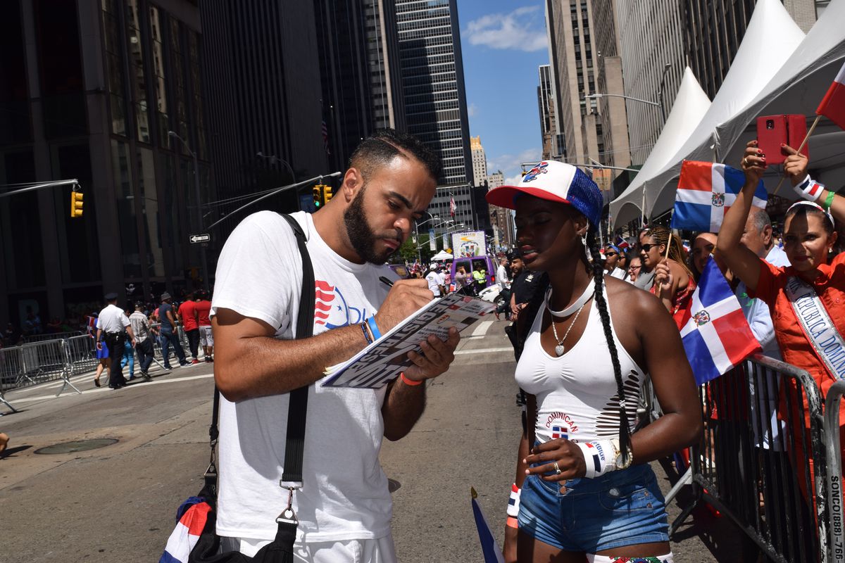 People register to vote during the 2019 Dominican Day Parade.