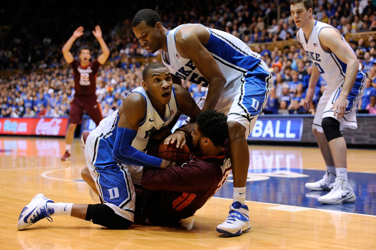 DURHAM, NC - FEBRUARY 25: Trevor Thompson #32 of the Virginia Tech Hokies battles with Rasheed Sulaimon #14 and Rodney Hood #5 of the Duke Blue Devils for a loose ball during their game at Cameron Indoor Stadium on February 25, 2014 in Durham, North 