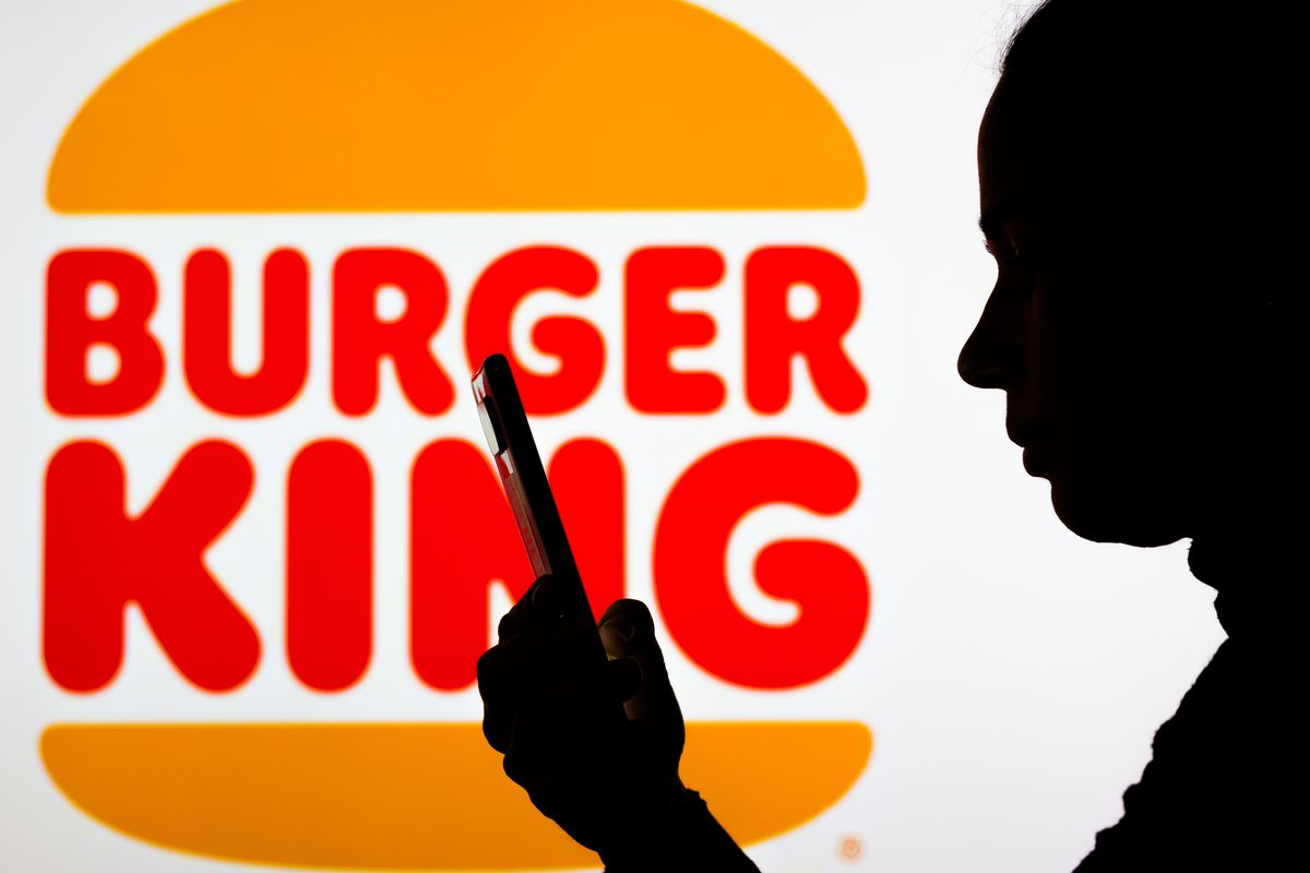 In this photo illustration the Burger King logo seen in the...
