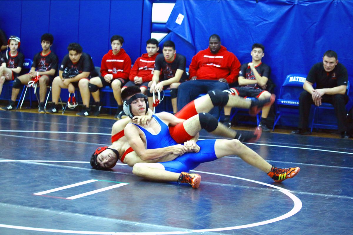 Two-time Public League champion Joey Arroyo of Taft, in blue, is preparing for a prep wrestling season that’s now scheduled to begin in April. 