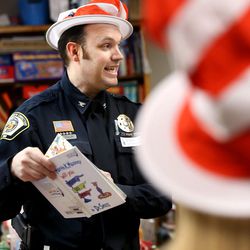 Utah Department of Corrections officer Bryan Taylor reads to Bella Vista Elementary students in Cottonwood Heights on Wednesday, March 2, 2016, in honor of Dr. Seuss’ birthday.