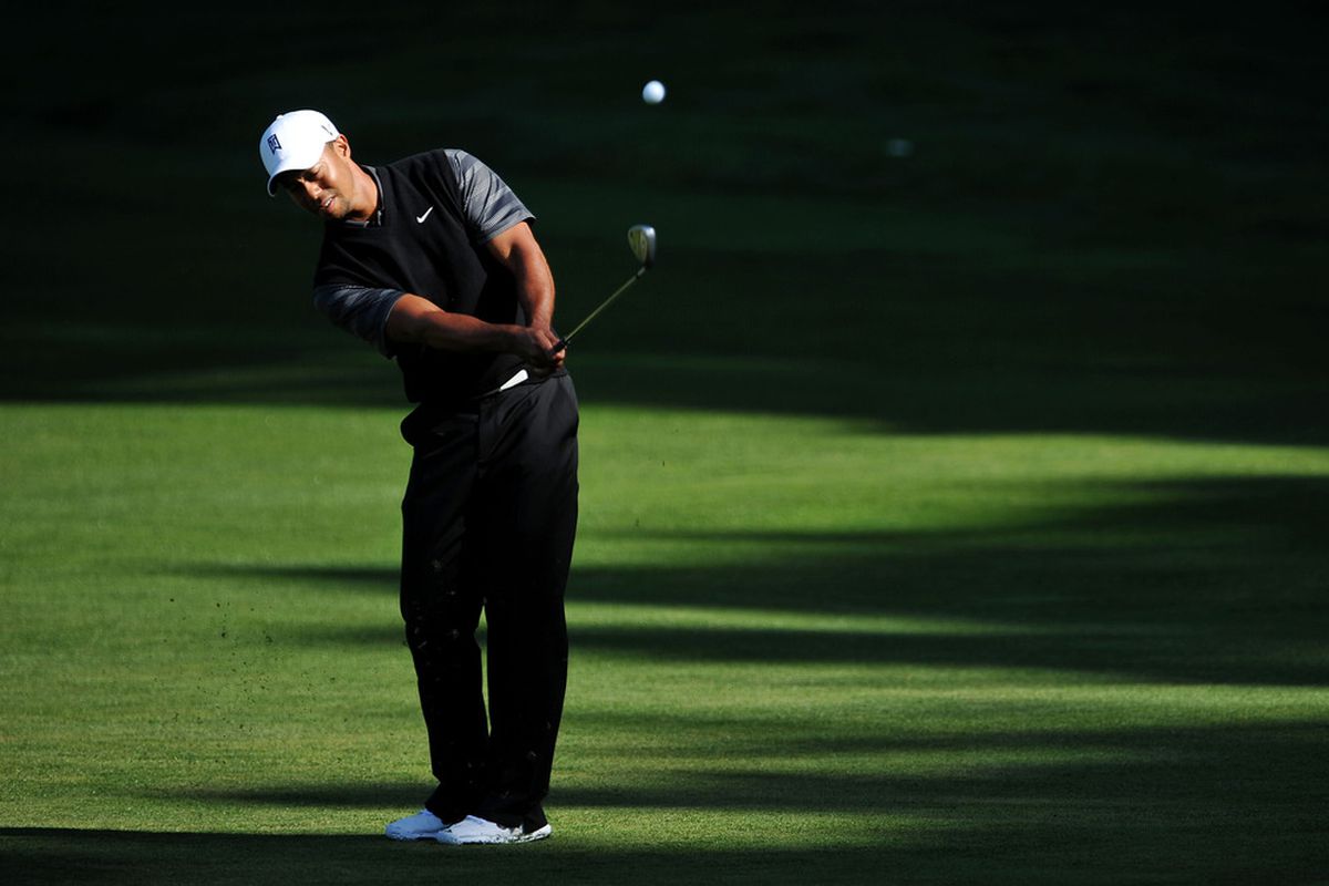DALY CITY, CA - JUNE 11: Tiger Woods of the United States hits a chip shot during a practice round prior to the start of the 112th U.S. Open at The Olympic Club on June 11, 2012 in Daly City, California.  (Photo by Stuart Franklin/Getty Images)