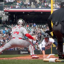 Logan O’Hoppe #14 of the Los Angeles Angels tags out Ty France #23 of the Seattle Mariners at home plate during the first inning at T-Mobile Park on April 05, 2023 in Seattle, Washington