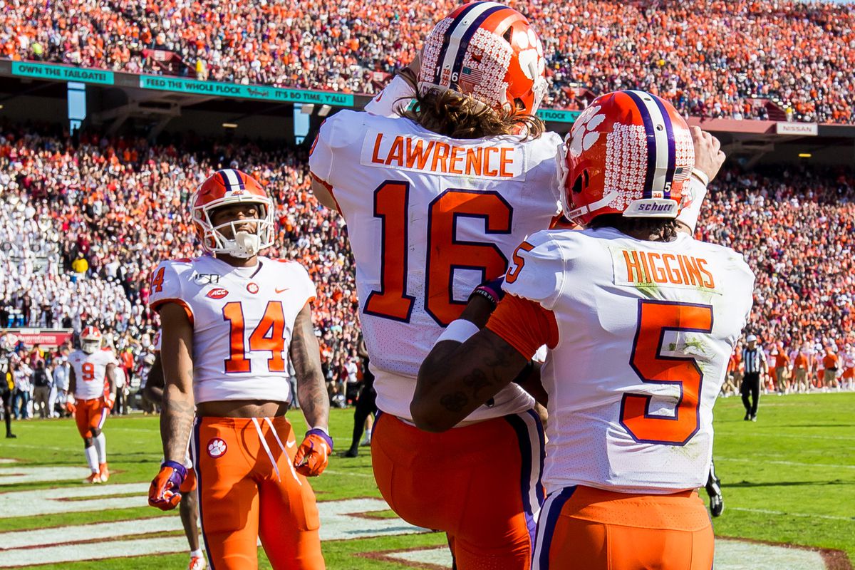 Clemson Tigers wide receiver Tee Higgins and quarterback Trevor Lawrence celebrate a touchdown reception by Higgins against the South Carolina Gamecocks at Williams-Brice Stadium.