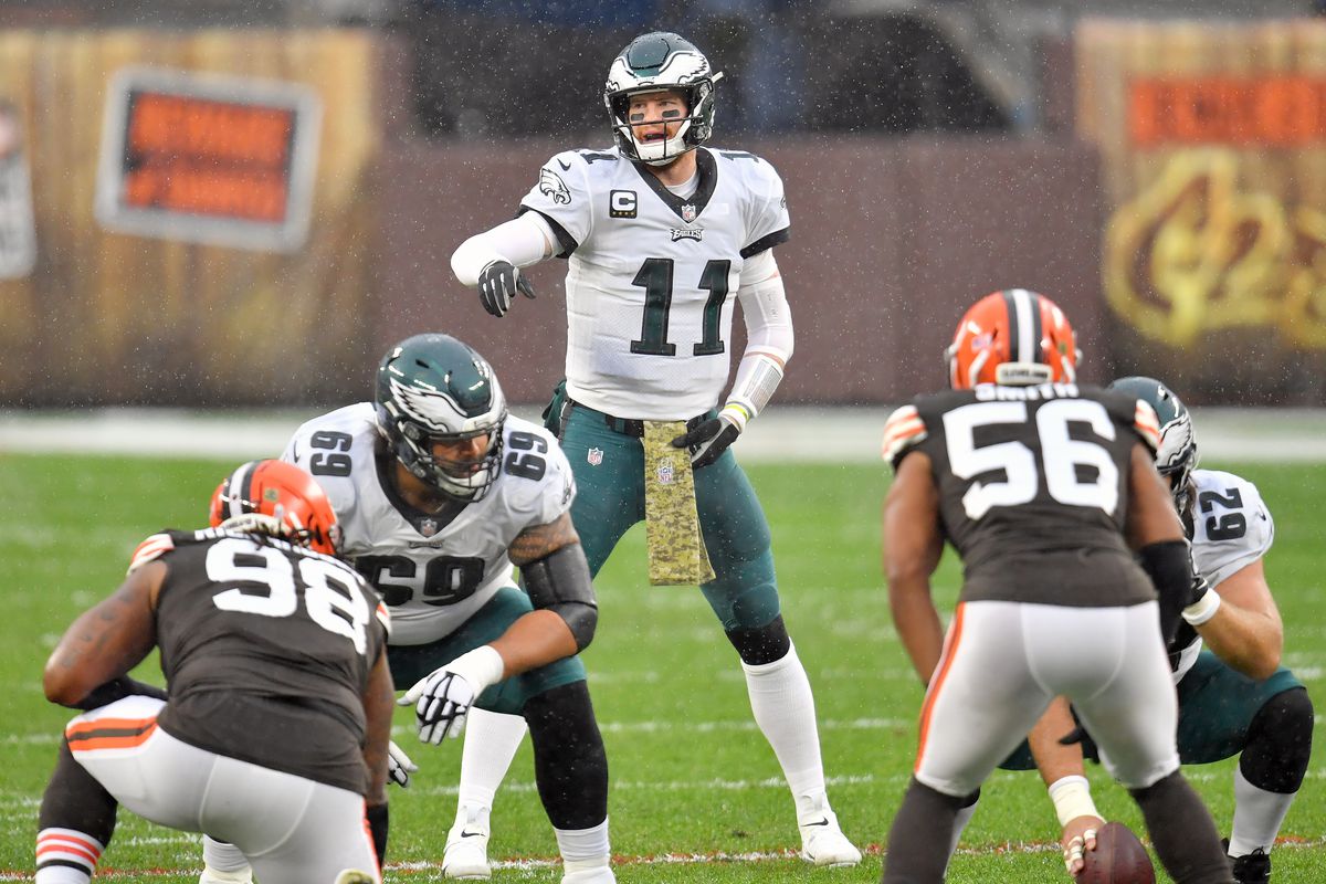 Carson Wentz #11 of the Philadelphia Eagles yells to his teammates from the line of scrimmage during the first half against the Cleveland Browns at FirstEnergy Stadium on November 22, 2020 in Cleveland, Ohio.