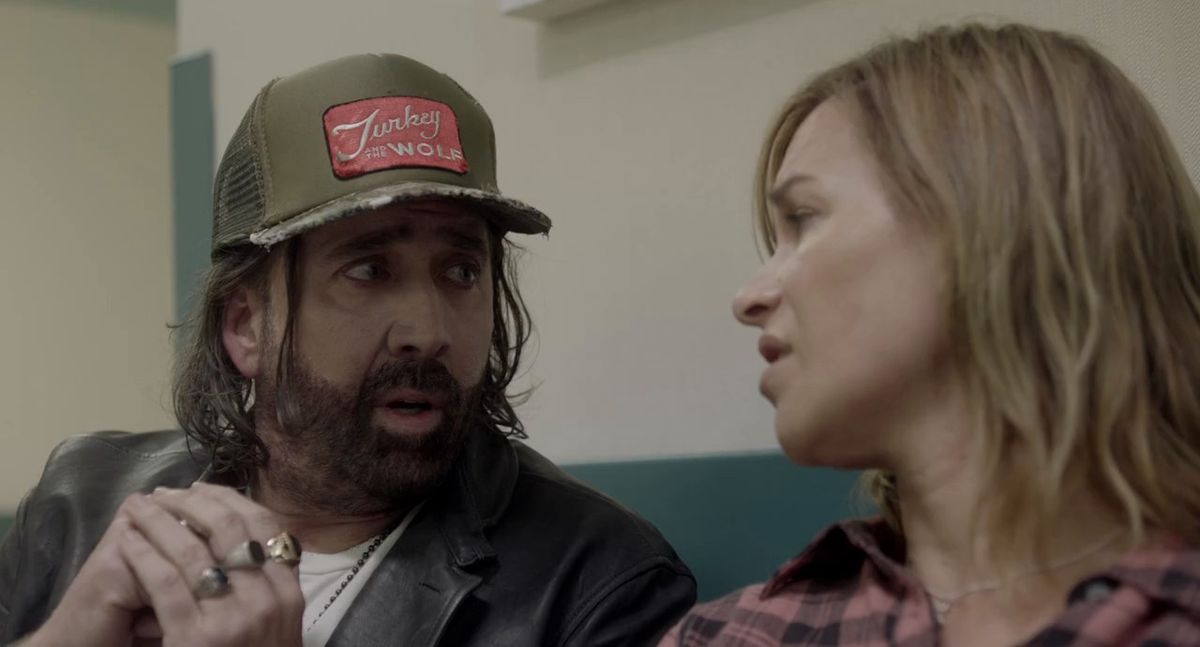 Nicolas Cage talks to Penelope Mitchell in Between Worlds.