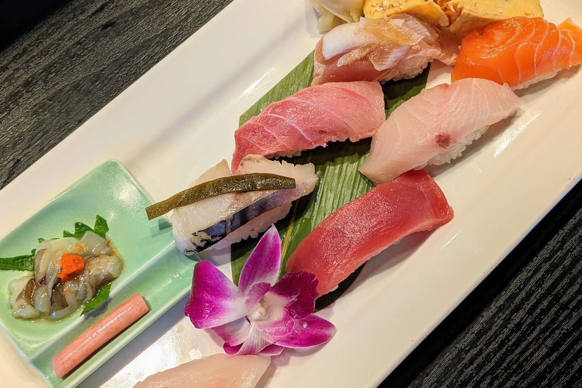 Colorful sushi nigiri on a rectangle plate.