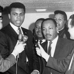 FILE - In this March 29, 1967, file photo, heavyweight champion Muhammad Ali, center left, and Dr. Martin Luther King speak to reporters. Ali, the magnificent heavyweight champion whose fast fists and irrepressible personality transcended sports and captivated the world, has died according to a statement released by his family Friday, June 3, 2016. He was 74. 