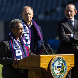 Chicago Fire Owner and Chairman Joe Mansueto and Major League Soccer Commissioner Don Garber (right) look on as Mayor Lori Lightfoot speaks during a press conference to announce the Fire will be returning to Soldier Field beginning with the 2020 season, Tuesday morning, Oct. 8, 2019.