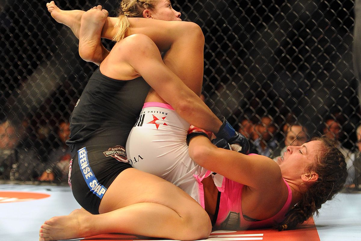 August 18, 2012; San Diego, CA, USA; Miesha Tate (white shorts) fights Juli...