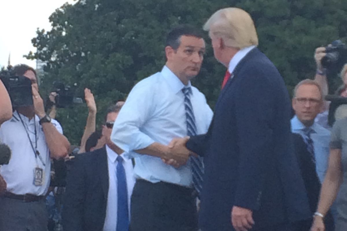 Republican presidential candidates Ted Cruz (left) and Donald Trump (right) shake hands in front of the Capitol at a rally against the Iran nuclear deal.