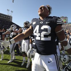 Brigham Young Cougars tight end Kyle Griffitts (42) and BYU celebrate their win over the USC Trojans in Provo on Saturday, Sept. 14, 2019. BYU won 30-27 in overtime.
