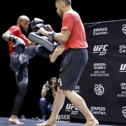 Demetrious Johnson kicks pads at the UFC 227 open workouts in Los Angeles, California.