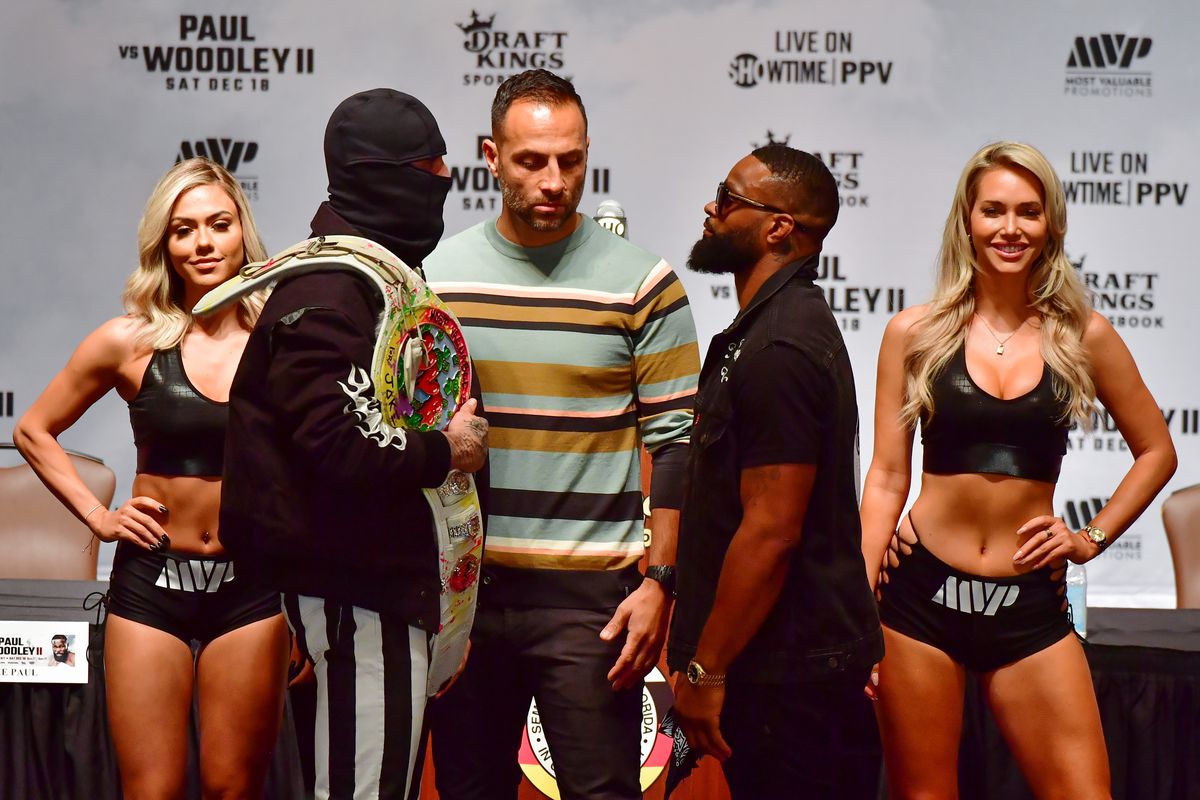Jake Paul and Tyron Woodley size up during a press conference at the Seminole Hard Rock Tampa prior to a December 18th cruiserweight fight on December 16, 2021 in Tampa, Florida.