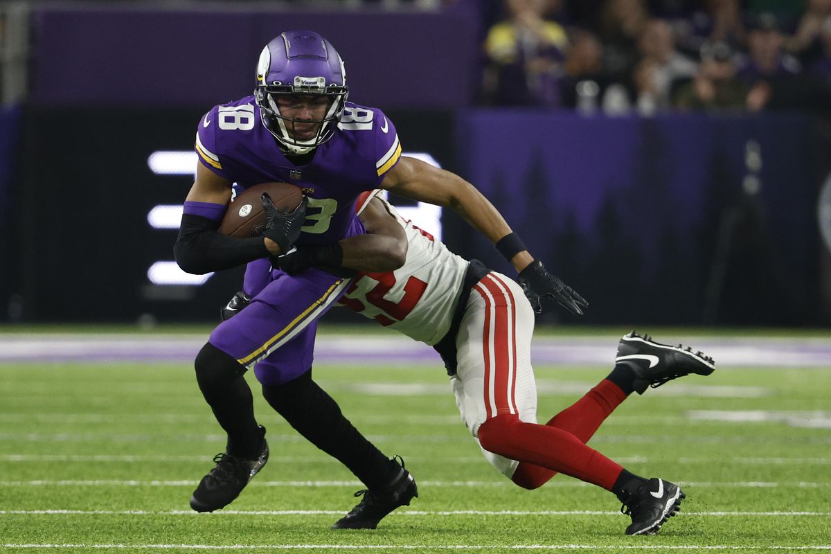 Justin Jefferson #18 of the Minnesota Vikings is tackled by Adoree’ Jackson #22 of the New York Giants during the third quarter in the NFC Wild Card playoff game at U.S. Bank Stadium on January 15, 2023 in Minneapolis, Minnesota.