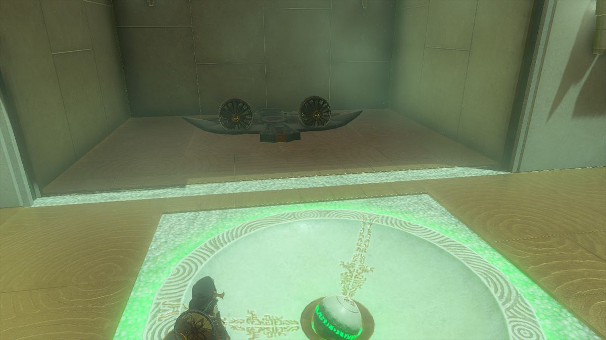 Link stares at a wing with two fans on it in the Orochium Shrine in Zelda Tears of the Kingdom.