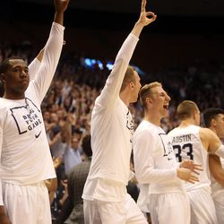 The Brigham Young Cougars bench celebrates a three-point basket during the first round of the NIT versus the UAB Blazers at the Marriott Center in Provo, Wednesday, March 16, 2016.