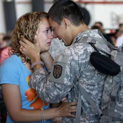 Private Nico Velazquez hugs Rachel Scoggins soldiers of the Utah National Guard's 624th Engineer Company, 204th Maneuver Enhancement Brigade,  departed Utah on the first leg of their 12-month deployment to Afghanistan in Salt Lake City  Wednesday, June 13, 2012. 