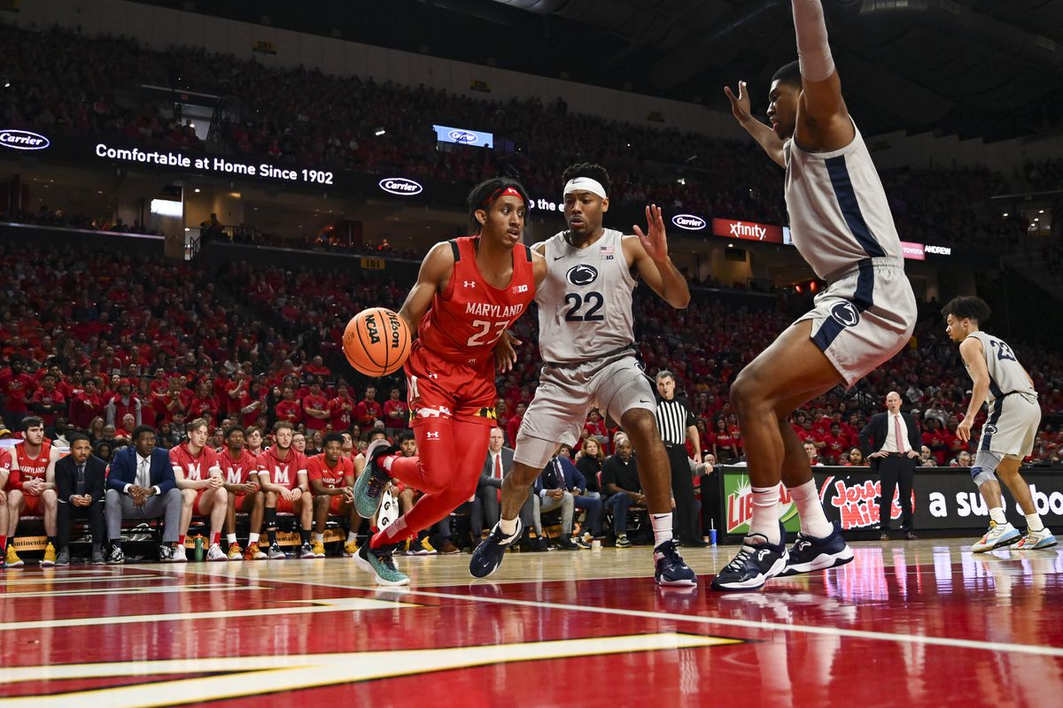 Feb 11, 2023; College Park, Maryland, USA; Maryland Terrapins guard Ian Martinez (23) dribbles down the baseline as Penn State Nittany Lions guard Jalen Pickett (22) defends during the second half at Xfinity Center.