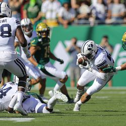 BYU’s Isaiah Kaufusi recovers a fumble in first-half action against the USF Bulls at Raymond James Stadium in Tampa, Florida, on Saturday, Oct. 12, 2019.