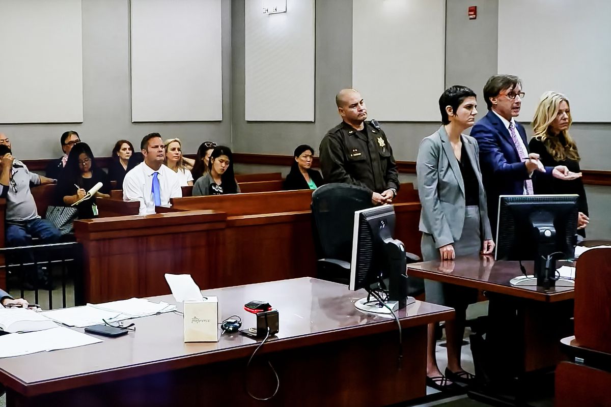 Lori Vallow, aka Lori Daybell, right, appears in court in Kauai, Hawaii on Friday, Feb. 21, 2020. Seated in the gallery is her husband, Chad Daybell, front row in blue tie.