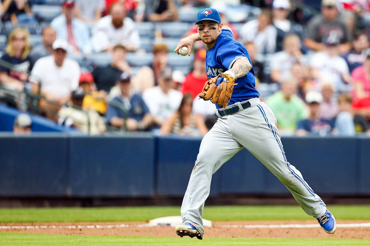 June 10, 2012; Atlanta, GA, USA; Toronto Blue Jays third baseman Brett Lawrie (13) throws to first for an out in the sixth inning of the game against the Atlanta Braves at Turner Field. Mandatory Credit: Daniel Shirey-US PRESSWIRE